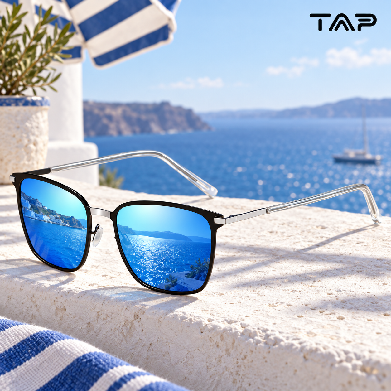 Blue mirrored sunglasses on a white seaside ledge
